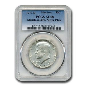 Close-up of 1977-D Kennedy half dollar struck on 40% silver planchet showing solid silver-gray edge with no copper stripe