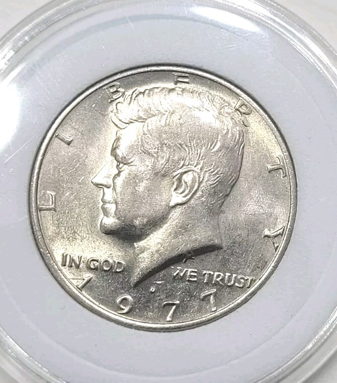 Close-up of 1977-D Kennedy half dollar DDO FS-101 doubled die obverse showing doubling on IN GOD WE TRUST inscription